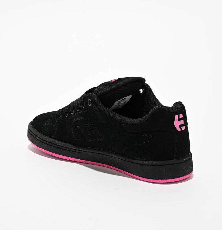 Black sneaker with pink accents on a white background