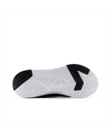 White athletic shoe with black sole on a white background