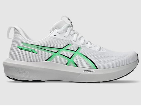 White running shoe with green accents on a light gray background