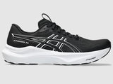 Black running shoe with white sole on a gray background