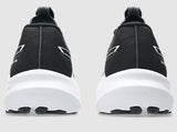 Black athletic shoes with white soles on a light gray background