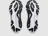 White and black sneaker soles with a unique pattern on a white background