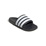 Black slide sandal with white stripes on a white background