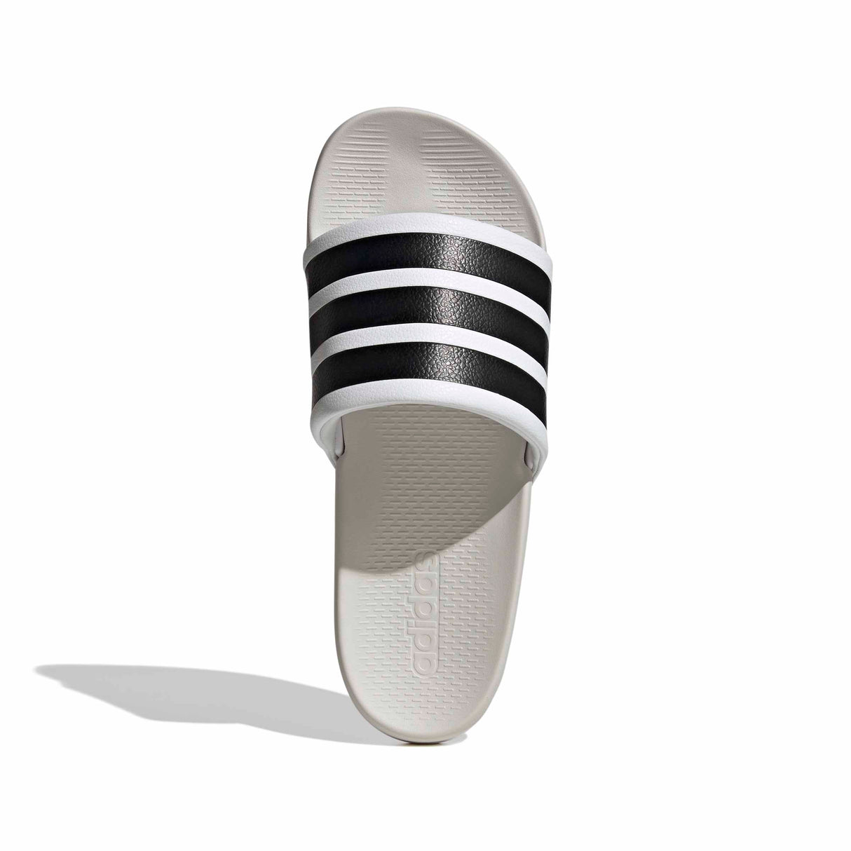 White slide sandal with black stripes on a white background