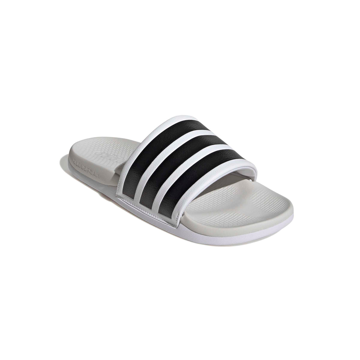 White slide sandal with black stripes on a white background
