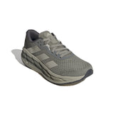 Gray athletic shoe with Adidas logo on a white background