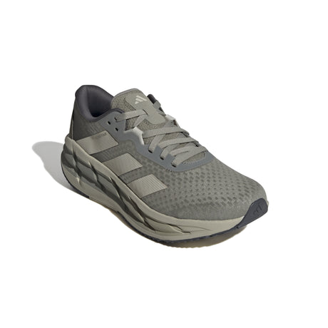 Gray athletic shoe with Adidas logo on a white background