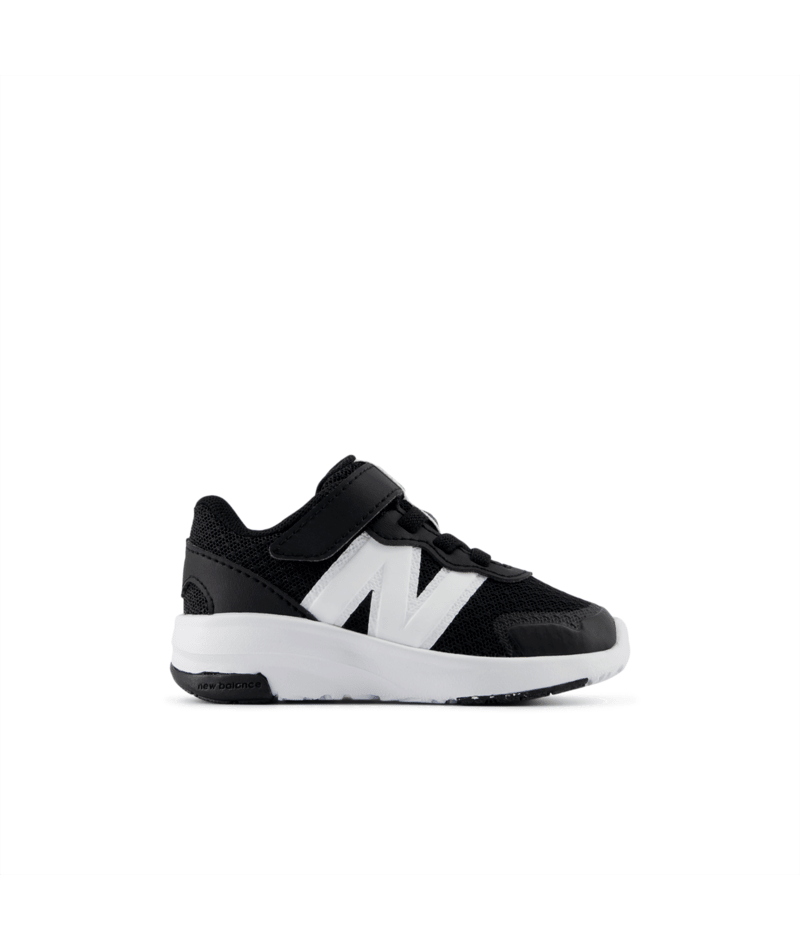 Black and white toddler sneaker with a white New Balance logo on a white background.  Can be purchased at www.sneakersplus.ca