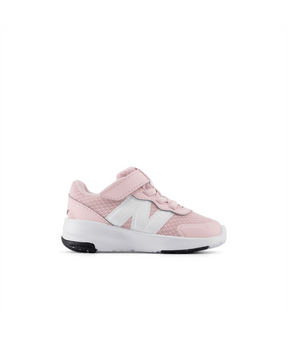 Pink sneaker with white New Balance logo on a white background.  Can be purchased at www.sneakersplus.ca