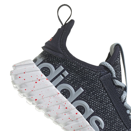 Black Adidas sneaker with white sole on a white background
