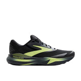 Black and green running shoe on a white background