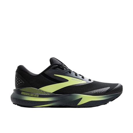 Black and green running shoe on a white background