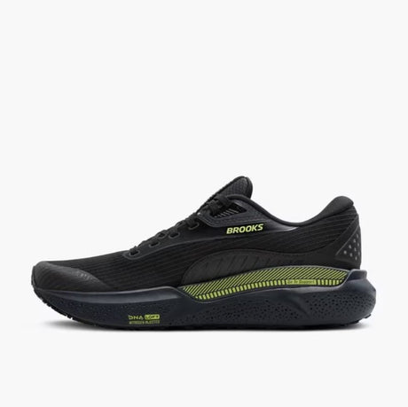 Black running shoe with green accents on a white background