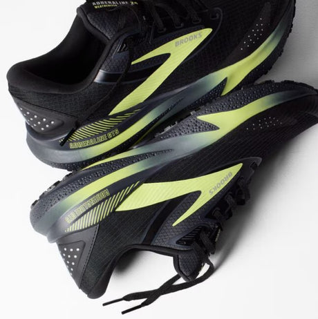 Black and yellow running shoes on a white background
