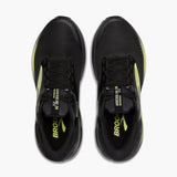 Black running shoes with yellow accents on a white background