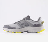 Gray and yellow running shoe on a white background