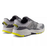 Gray and yellow running shoes on a white background