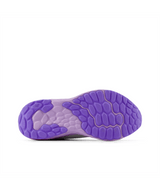 Purple sole of a shoe on a white background