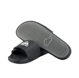 Black slides with gray soles on a light gray background