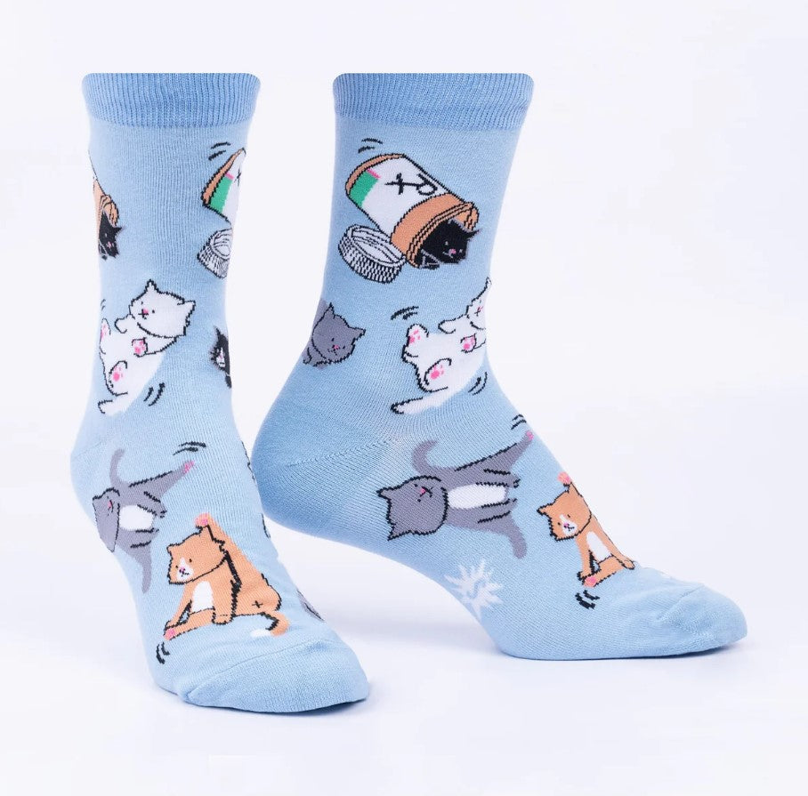 Light blue socks with cartoon cat designs on a white background