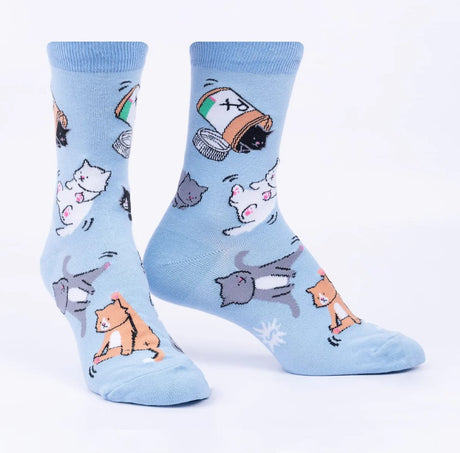 Light blue socks with cartoon cat designs on a white background