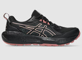 Black and pink running shoe on a gray background