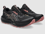 Black and pink running shoes on a light gray background