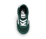 Green and white sneaker with Vans logo on the sole from a top down view on a white background