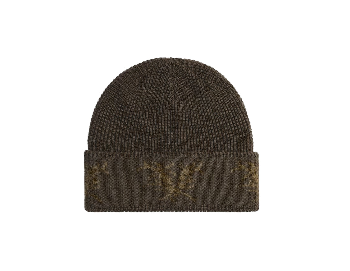 Brown knit beanie with a pattern on a white background