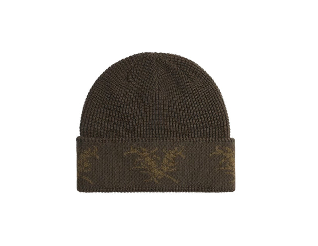 Brown knit beanie with a pattern on a white background
