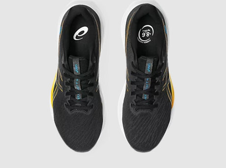 Black running shoes with yellow accents on a white background