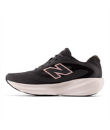 Dark gray running shoe with white sole on a light gray background