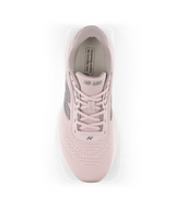 Pink sneaker with gray accents on a white background