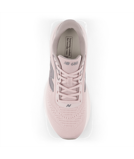 Pink sneaker with gray accents on a white background