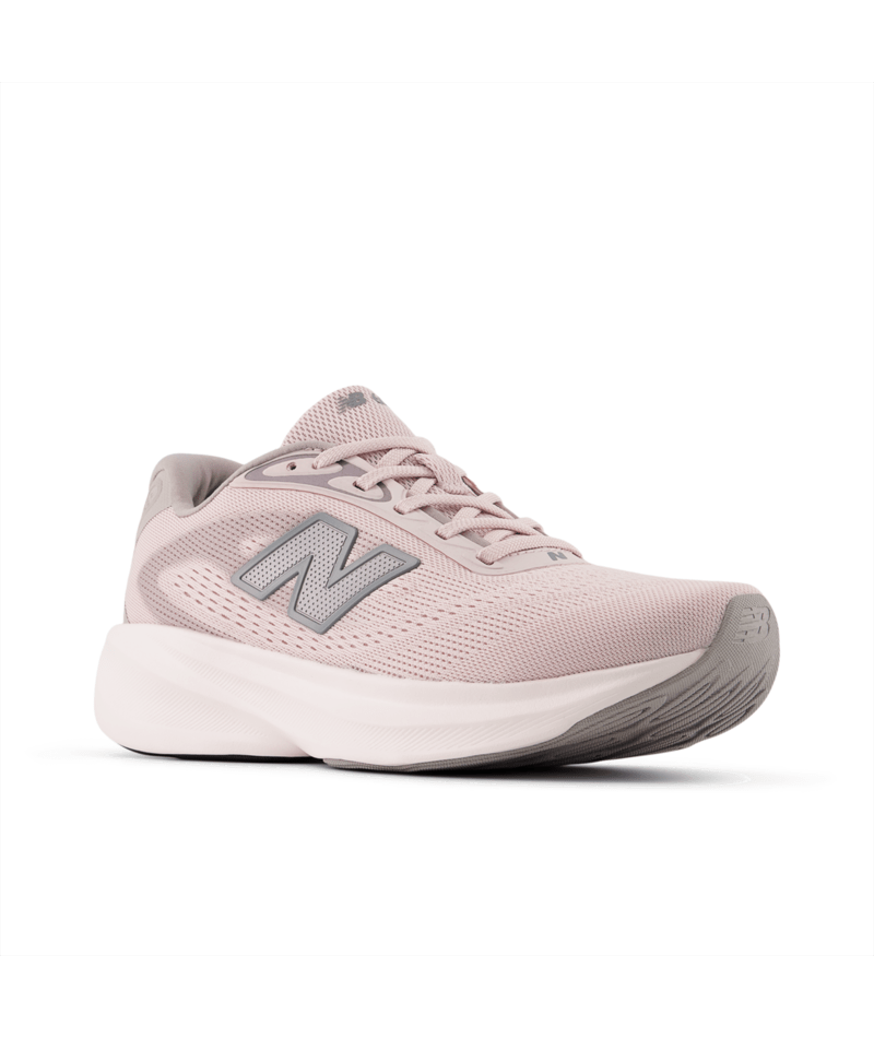 Pink running shoe with New Balance logo on a white background
