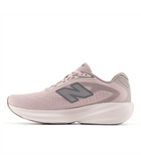 Pink running shoe with New Balance logo on a white background