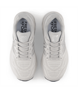 Pair of light gray running shoes with 'Fresh Foam' branding on a white background