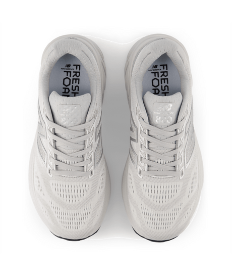 Pair of light gray running shoes with 'Fresh Foam' branding on a white background