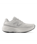 Gray running shoe with New Balance logo on a white background.  Can be purchased at www.sneakersplus.ca