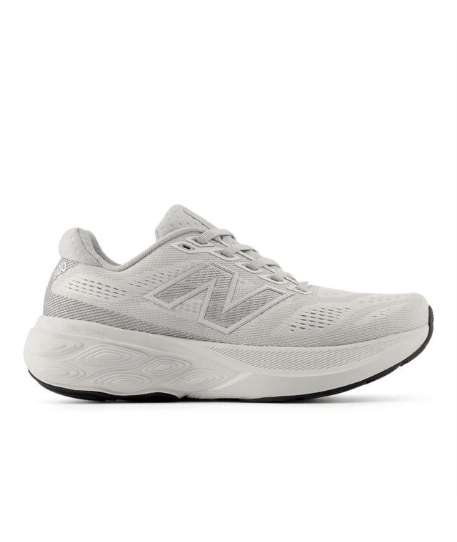 Gray running shoe with New Balance logo on a white background.  Can be purchased at www.sneakersplus.ca