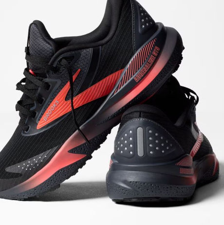 Black and red athletic shoes on a white background