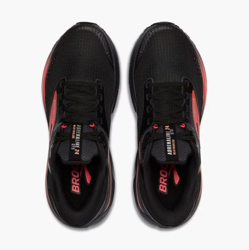 Black and red athletic shoes on a white background
