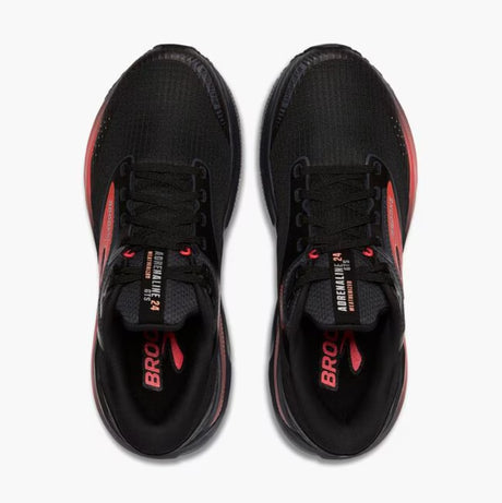 Black and red athletic shoes on a white background