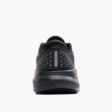 Black athletic shoe with red accents on a white background