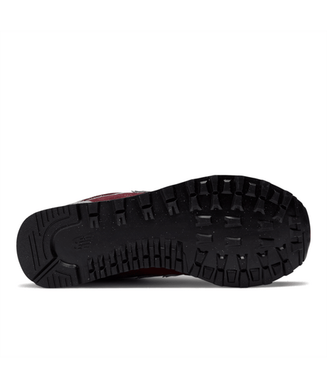 Close-up of a shoe sole with tread pattern on a white background