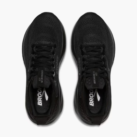 Black running shoes with 'Brooks' branding on a white background