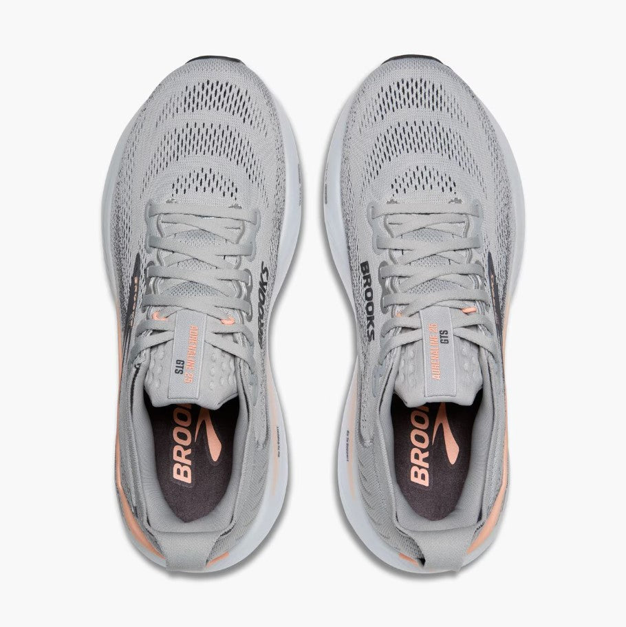 Pair of gray running shoes with 'Brooks' branding on a white background