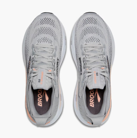 Pair of gray running shoes with 'Brooks' branding on a white background