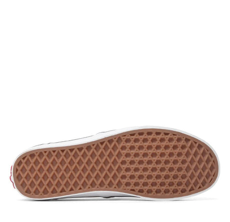 Close-up of a brown sole with diamond pattern on a white background