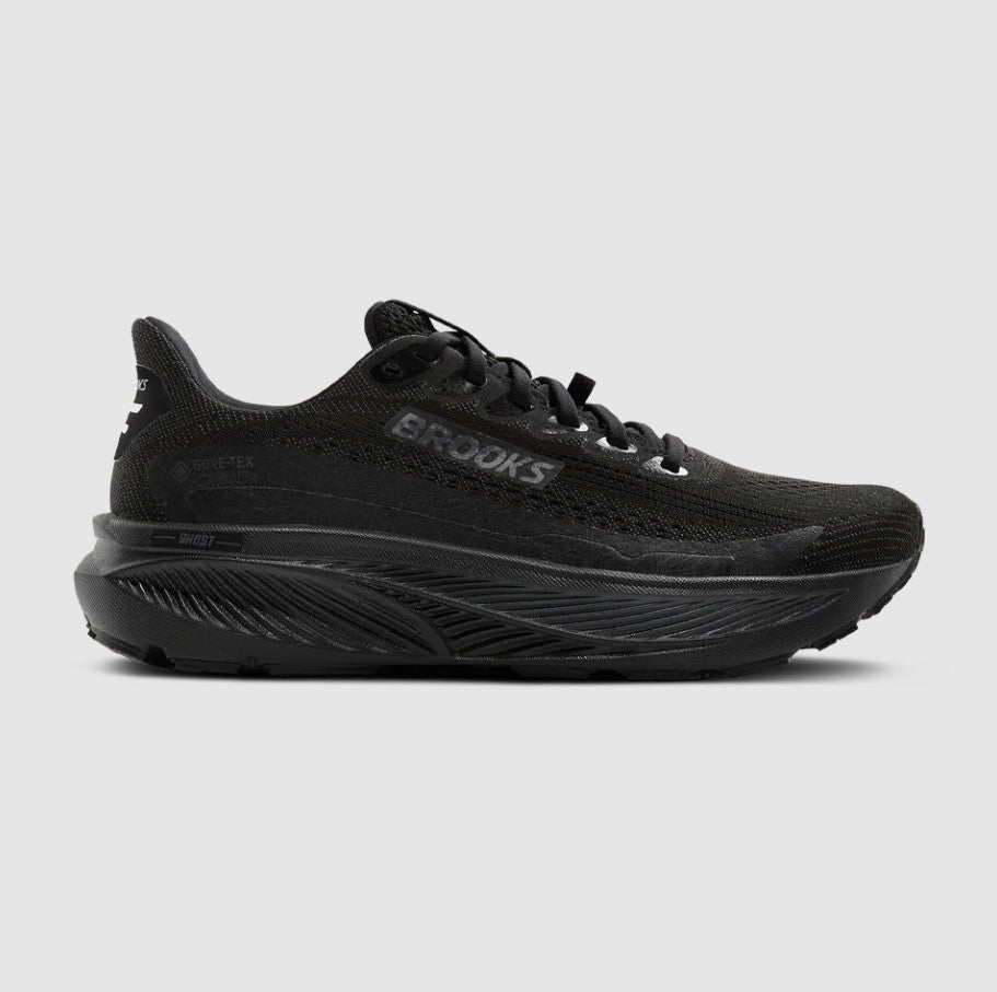 Black running shoe with 'Brooks' branding on a light gray background